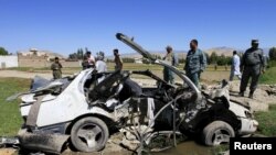 File photo of the wreckage of a vehicle at the site of a roadside bomb in eastern Afghanistan in April.