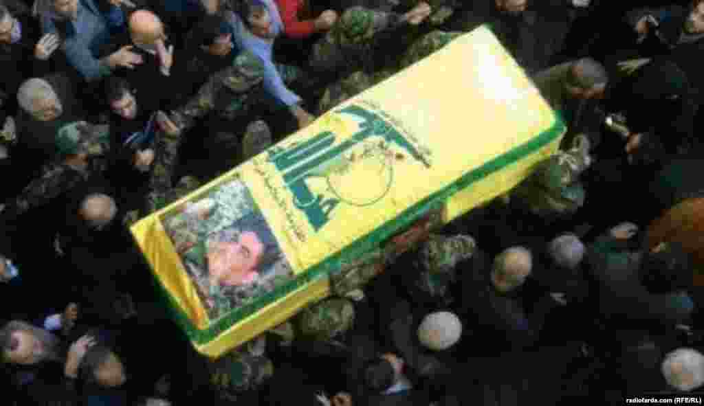 Members of Lebanon&#39;s militant Shi&#39;ite Muslim movement Hizbollah carry Kantar&#39;s coffin. Eight other people were reported killed in the strike near Damascus on December 20.