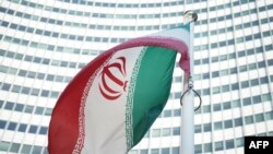 An Iranian flag flies outside the Vienna International Center where the so-called EU 5+1 talks with Iran are taking place inside.