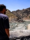 A man views the low water inlet upstream of the Amir Kabir Dam on the Karaj River in Iran's northern Alborz mountains in June.