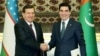 Uzbek President Shavkat Mirziyaev (left) and Turkmen President Gurbanguly Berdymukhammedov shake hands on March 7.