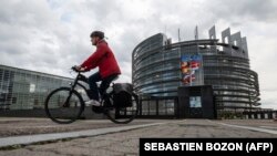 A man rides a bike in front of the European Parliament in Strasbourg, France. (file photo)