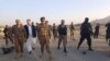 Pakistani authorities inspect the site of a roadside bomb that killed at least six people in North Waziristan on December 5. 