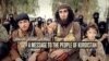 A capture of Kurdish Islamic State (IS) militant Abu Khattab al-Kurdi and his young son (pixelated) from a video purportedly by militant group Islamic State that concludes with the murder of a Kurdish-speaking captive.