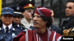 Libyan leader Muammar Qaddafi takes part in an official welcoming ceremony in Kyiv in 2008.