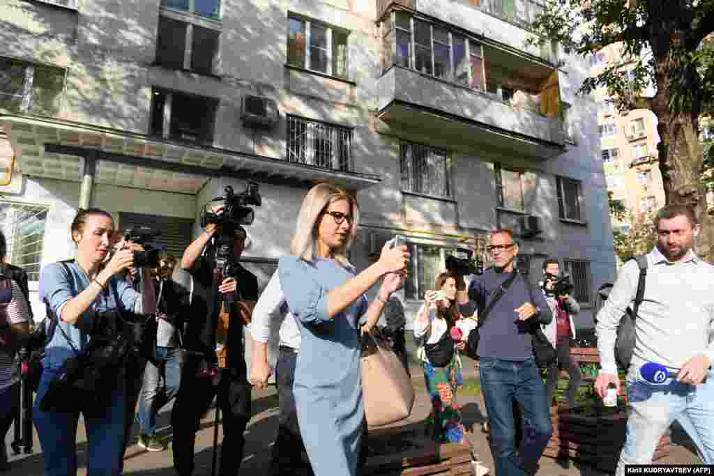 Russian opposition activist Lyubov Sobol (center) after casting her vote in Moscow. Sobol, a close ally of Navalny, was barred from running by authorities due to alleged irregularities in her application for candidacy.&nbsp;