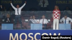 French President Emmanuel Macron celebrates next to his wife, Brigitte, after the World Cup victory.