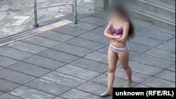 Videos emerged on social media on November 2 showing a young woman stripped to her underwear and walking around outside a university in Tehran.