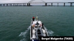 A Russian Border Service patrol boat approaches the Kerch Strait Bridge, near Crimea, on December 5.