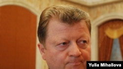 Vladimir Turcan said the Communists' boycott of the election forced him to leave.