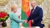 Alyaksandr Lukashenka (right) shakes hands with Central Election Commission chief Lydzia Yarmoshyna during a ceremony in Minsk in September 2020.