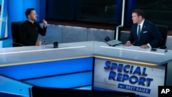 Ukrainian President Volodymyr Zelenskyy (left) speaks during an interview with Bret Baier of Fox News.