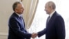 Russian President Vladimir Putin (right) shakes hands with US special envoy Steve Witkoff during a meeting at the Constantine Palace in St Petersburg on October 21.