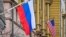A Russian flag hangs at a building next to the U.S. Embassy in Moscow. (file photo)