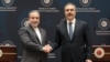 Turkish Foreign Minister Hakan Fidan shakes hands with his Iranian counterpart, Abbas Araqchi, during a press conference in Istanbul on January 30.
