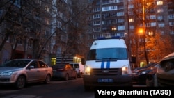 A police vehicle stands outside a residential building in Moscow's Lyublinskaya Street, where Russian opposition activist Aleksei Navalny's apartment is located.