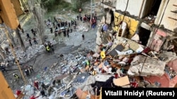 A view of rescue efforts from inside an apartment building hit by a Russian air strike in Kharkiv on September 24.