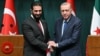 Turkish President Recep Tayyip Erdogan (R) and Syria's interim president Ahmed al-Sharaa shake hands during a joint press conference following their meeting at the Presidential Palace in Ankara, on February 4, 2025.