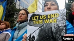 People attend a protest against the ongoing Russian full-scale invasion of Ukraine on the day of a European Union leaders summit in Brussels on October 26.