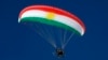 A paramotorist using a wing in the colors of the Kurdish flag flies over the Korek Mountain resort, near the city of Rawanduz in Iraq's northern autonomous Kurdish region, on February 16.