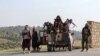 Afghan security personnel deployed in the Zazai Maidan district of Khost Province near the border with Pakistan on October 12 