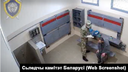 A still image from a video purportedly showing prison officials bandaging the head of a prisoner they identify as Vitold Ashurak.