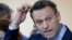 Russian opposition figure Aleksei Navalny reacts during the slander lawsuit filed against him by Russian businessman Alisher Usmanov, in a court in Moscow on May 30. 