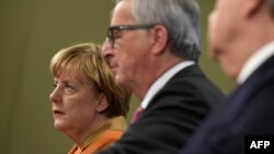 Angela Merkel și Jean-Claude Juncker