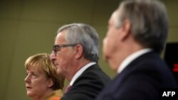 Angela Merkel, Jean Claude Juncker, i UNHCR šef Antonio Guterres 