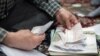 Counting votes after parliamentary elections in Iran, Saturday February 27, 2016.