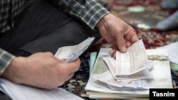 Counting votes after parliamentary elections in Iran, Saturday February 27, 2016.