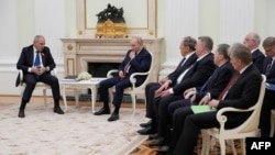 Russian President Vladimir Putin (C) and Armenian Prime Minister Nikol Pashinyan (L) hold talks at the Kremlin in Moscow, on April 1, 2026.