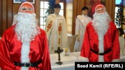 Iraq - Two figures of Santa Claus at the Christmas exhibition, Baghdad, undated