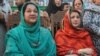 Kulsoom Nawaz (left) and Maryam Nawaz attend the election campaign meeting in Lahore in May 2013. 