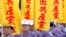 Members of Falun Gong hold slogans reading "Secede from the Communist Party" during a march in Taipei, Taiwan, in 2009.