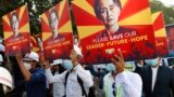 BURMA -- MYANMAR -- Engineers hold posters with an image of deposed Myanmar leader Aung San Suu Kyi as they hold an anti-coup protest march in Mandalay, Myanmar Monday, Feb. 15, 2021. 