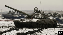 Russian T-72B3 tanks take part in drills at a firing range in the Rostov region, which borders Ukraine. 