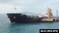 An Iranian oil tanker is anchored at a dock near Puerto Cabello, Venezuela on May 25. The United States has justified a new round of sanctions against actors in Iran's oil sector, saying revenue from oil sales supports the Quds Force.