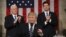 U.S. -- Vice President Mike Pence (L) and Speaker of the House Paul Ryan (R) applaud as US President Donald J. Trump (C) arrives to deliver his first address to a joint session of Congress from the floor of the House of Representatives in Washington, Fe