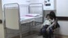 Armenia -- A child suffering from a respiratory virus and his mother wait in the hallway of Arabkir hospital, 8Jan2016