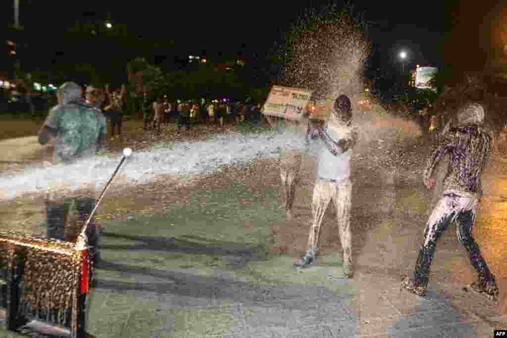 Israeli police uses water cannon during heavy clashes to disperse Ethiopian Israelis demonstrating in central Tel Aviv. The protests came three days after a stormy demonstration in Jerusalem sparked by footage showing two police officers beating an Israeli soldier of Ethiopian origin in uniform. More than 135,000 Ethiopian Jews live in Israel. (AFP/Jack Guez)