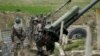 Nagorno-Karabakh -- Ethnic Armenian soldiers stand next to a cannon at artillery positions near the Nagorno-Karabakh's town of Martuni, April 7, 2016