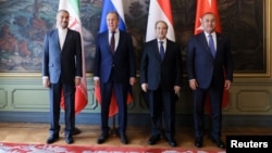 (Left to right) Foreign ministers Hossein Amirabdollahian of Iran, Sergei Lavrov of Russia, Faisal Mekdad of Syria, and Mevlut Cavusoglu of Turkey pose for a picture in Moscow on May 10.