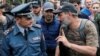 Armenia -- Armenian opposition leader Nikol Pashinyan talks to police Colonel Valeri Osipian during a rally in Yerevan, April 29, 2018.