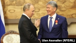 While one commenter noted that Kyrgyz President Almazbek Atambaev (right) may want to place loyalists in power after his term ends, it's not like Russia's Putin and Medvedev changing places.