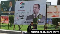 Iraqi campaign posters on the streets of Baghdad.