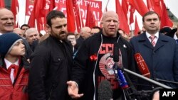 U.S.-born mixed martial arts fighter Jeff Monson (center) attends a wreath-laying ceremony to mark the 146th birthday of Soviet state founder Vladimir Lenin at his mausoleum on Red Square in Moscow in 2016. 