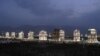 Turkmenistan -- A row of white-marble apartment buildings lit-up at night in Ashgabat, 05Jul2008