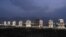 Turkmenistan -- A row of white-marble apartment buildings lit-up at night in Ashgabat, 05Jul2008