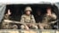 Ethnic Armenian Karabakh troops in the back of a truck on the way to the town of Martakert, Nagorno-Karabakh, in the midst of clashes with Azerbaijan on September 29.